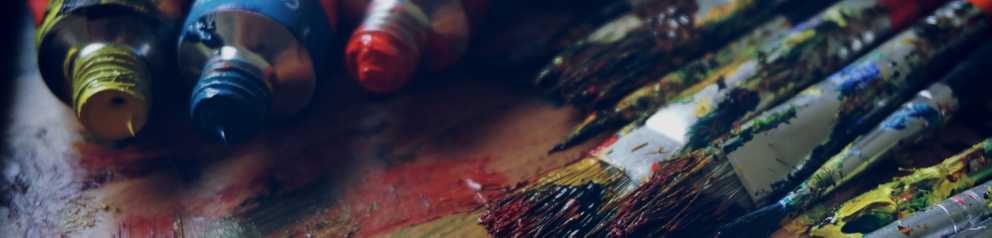 Cover image of paint and paint brushes laid out on a table